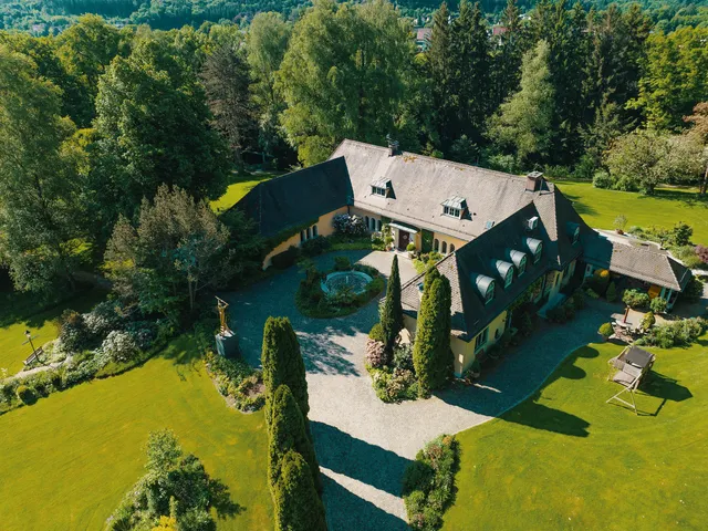 Aerial photograph of a country property with grounds, captured for a listing